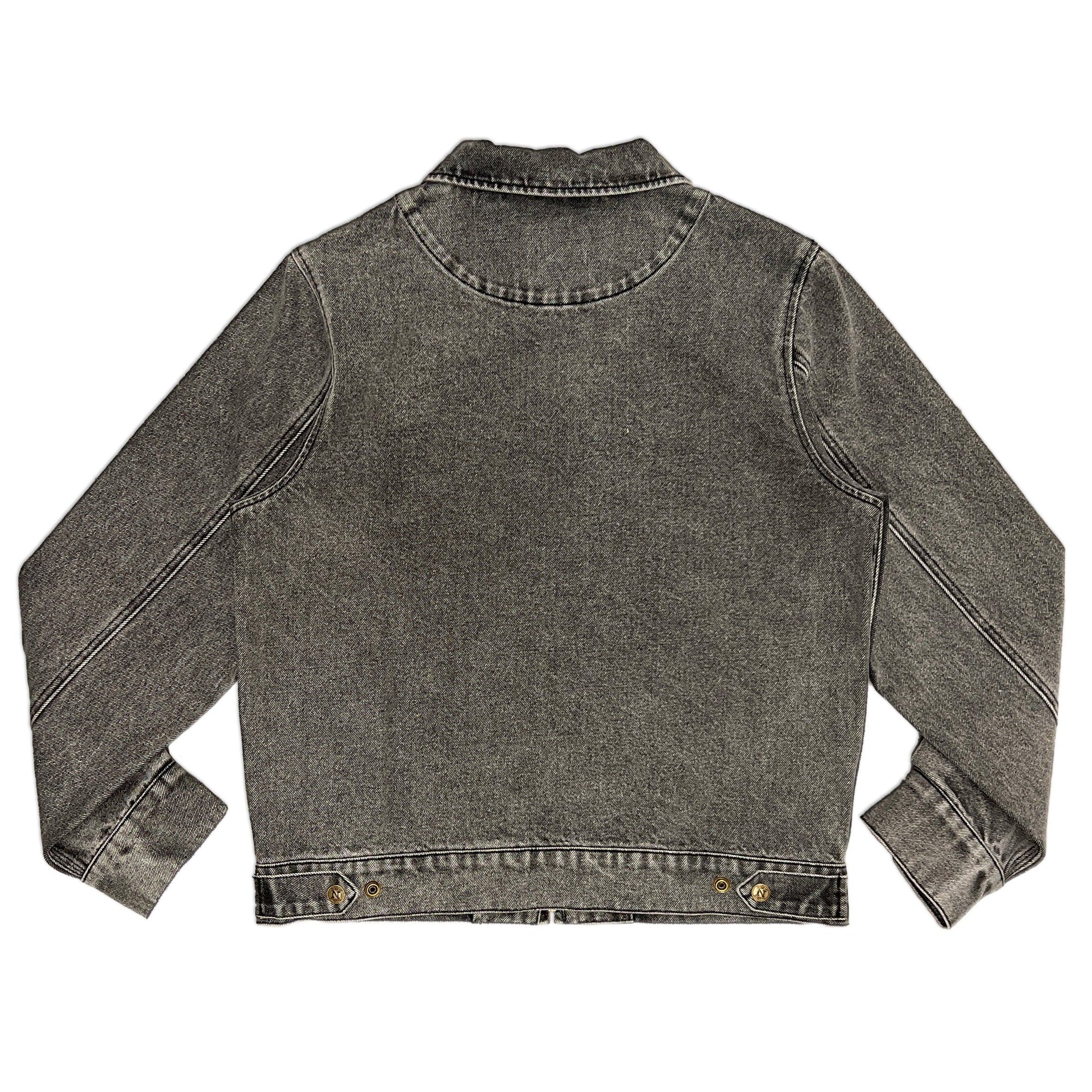 A washed charcoal gray denim jacket shown from the back, featuring long sleeves, a classic collar, and metal snap buttons at the hem, laid flat against a white background.