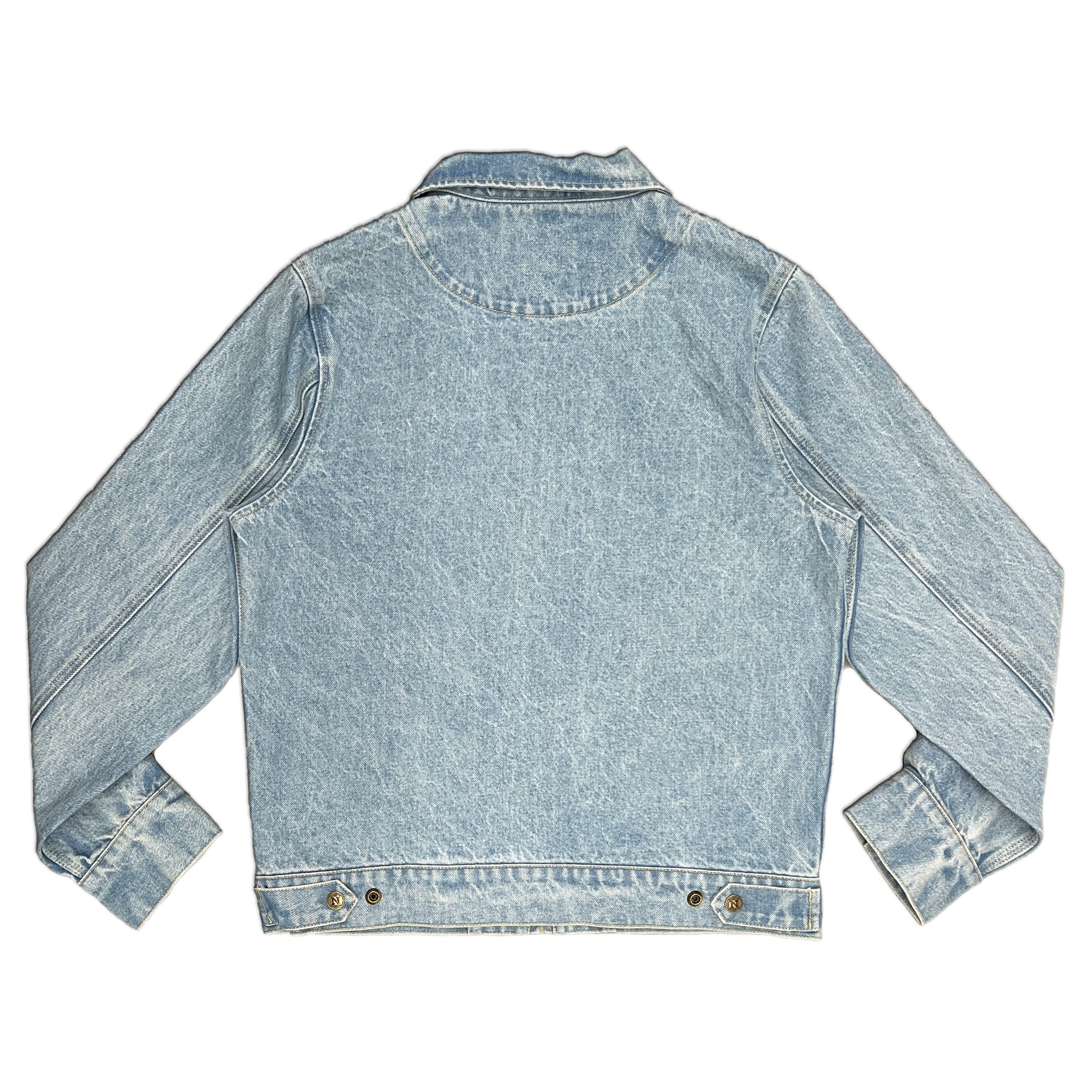 A light blue wash denim jacket shown from the back, featuring long sleeves, a classic collar, and metal snap buttons at the hem, laid flat against a white background.